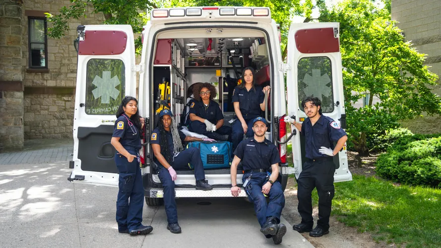 FUEMS students pose in ambulance
