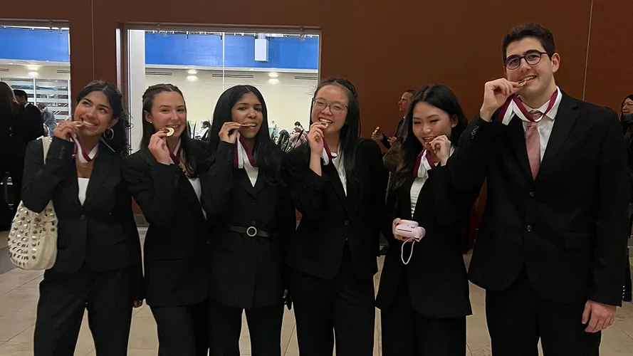 Students celebrate their success in the Gabelli School Consulting Cup