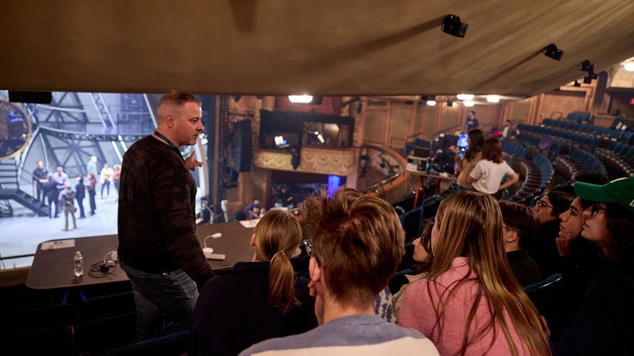 John Johnson teaches class on the balcony of the longacre theater