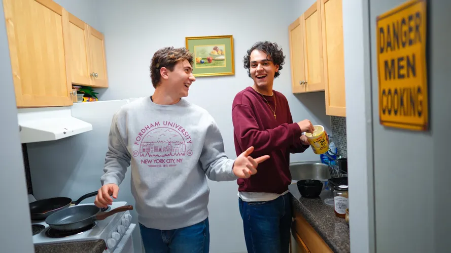 Two male students in dorm kitchen