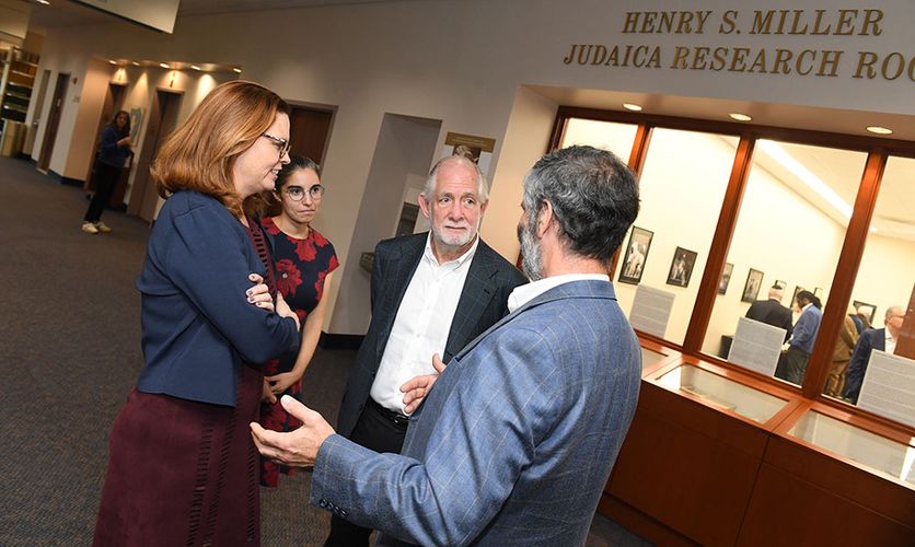 Miller outside the Judaica Research Room bearing his name with President Tania Tetlow and Professor Sarit Kattan Gribetz.