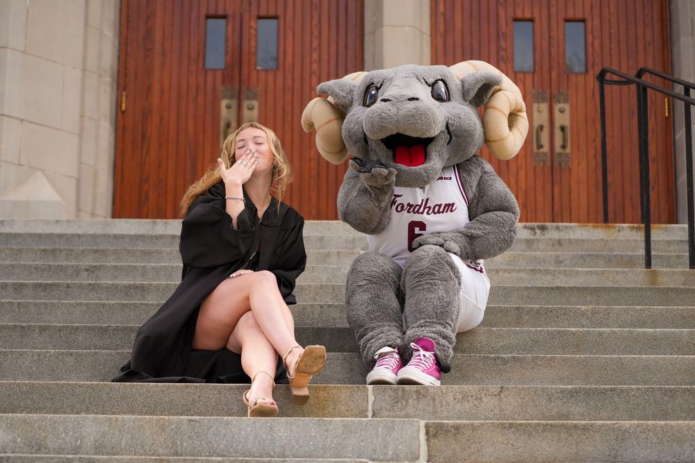 Abby Hartlieb and Ramses on the steps of Keating Hall