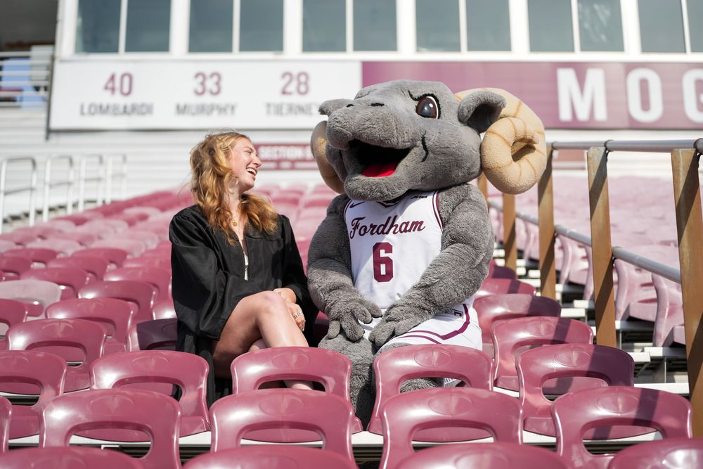 Abby Hartlieb and Ramses in the seats at Moglia Stadium