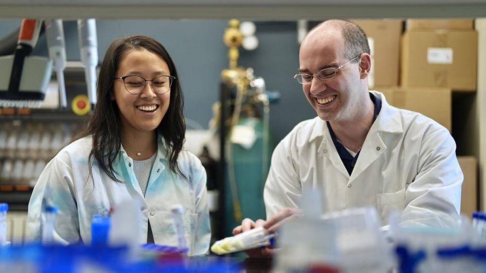 Clara Victorio working with classmate in lab