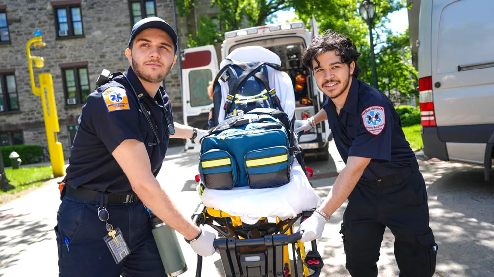 FUEMS students carry stretcher