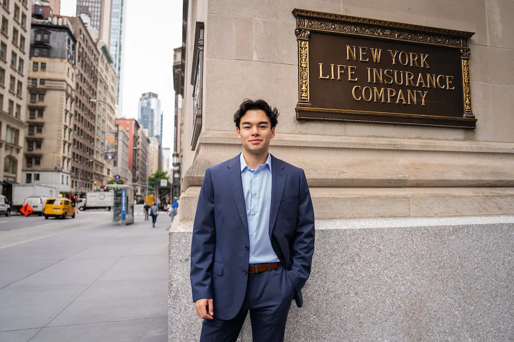Theo Vanderberg standing in front of the New York Life building