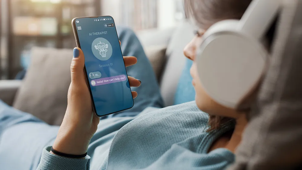A young woman consulting an AI therapist on her smartphone