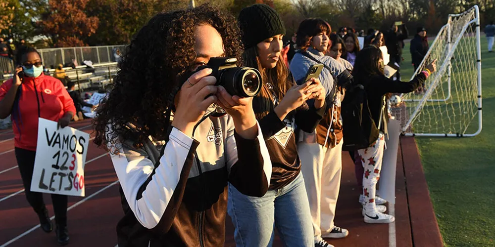 Student taking a picture on camera