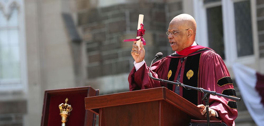 Rev. Dr. Calvin O. Butts, III, addresses the Class of 2022 at Fordham’s 177th Commencement on Edwards Parade at the Rose Hill campus