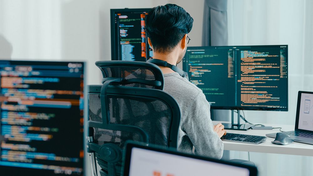 Male student working at a computer