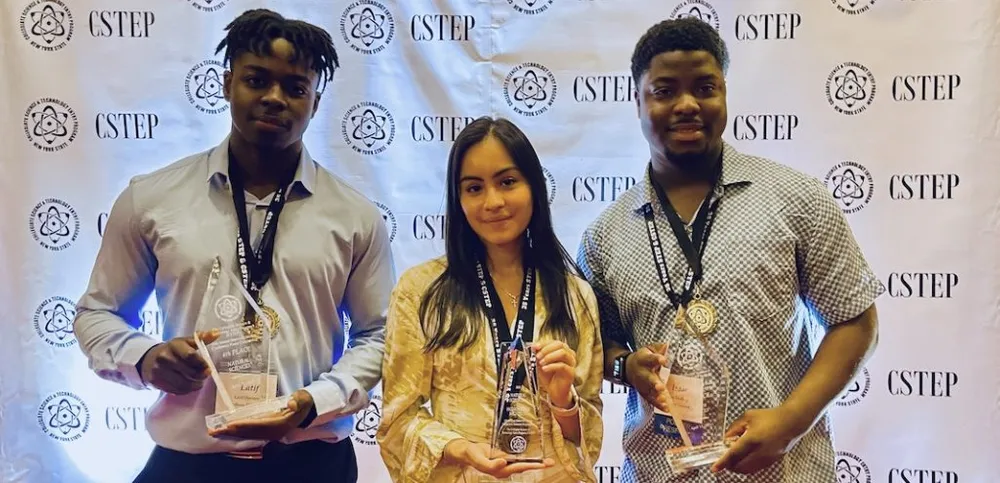 Latif Diaoune, Daphne Buitron, and Isaac Mullings at the CSTEP conference.
