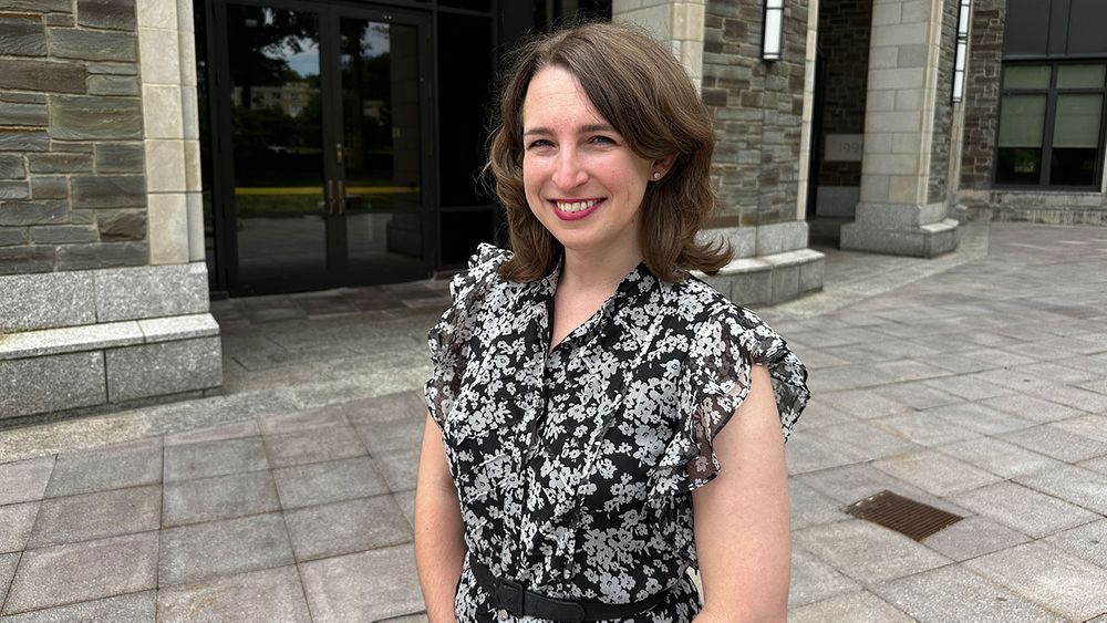 Elisabeth Buck outside Walsh Library, home of the Writing Center at Rose Hill.