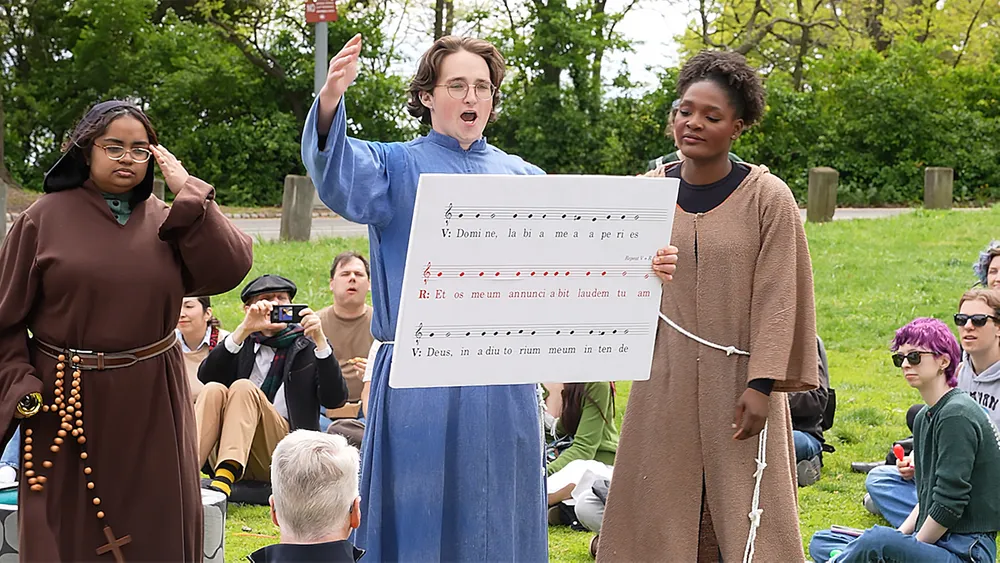 Student performing medieval dramatic scenes at the Met Cloisters