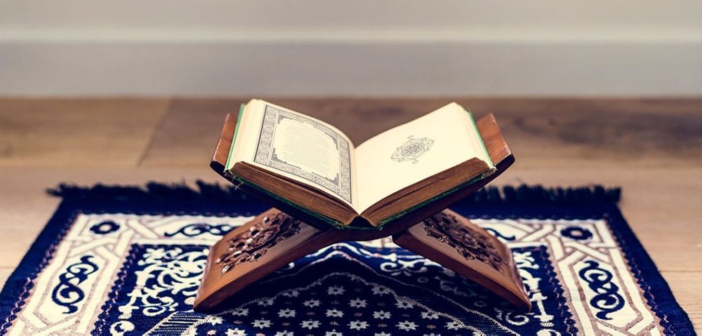 An open Quran on a stand