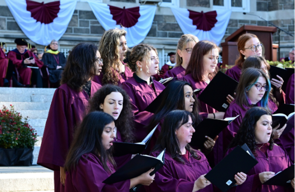 Students sing in choir outside at Rose Hill