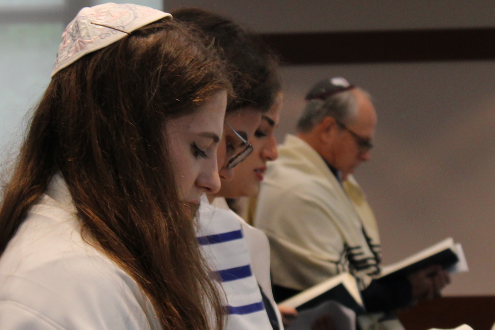 Students engaging in prayer