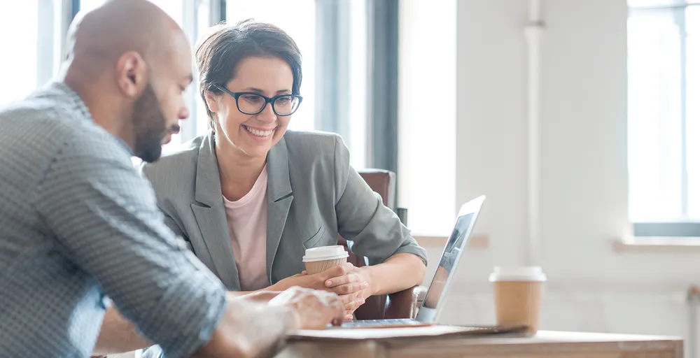 Students looking at computer