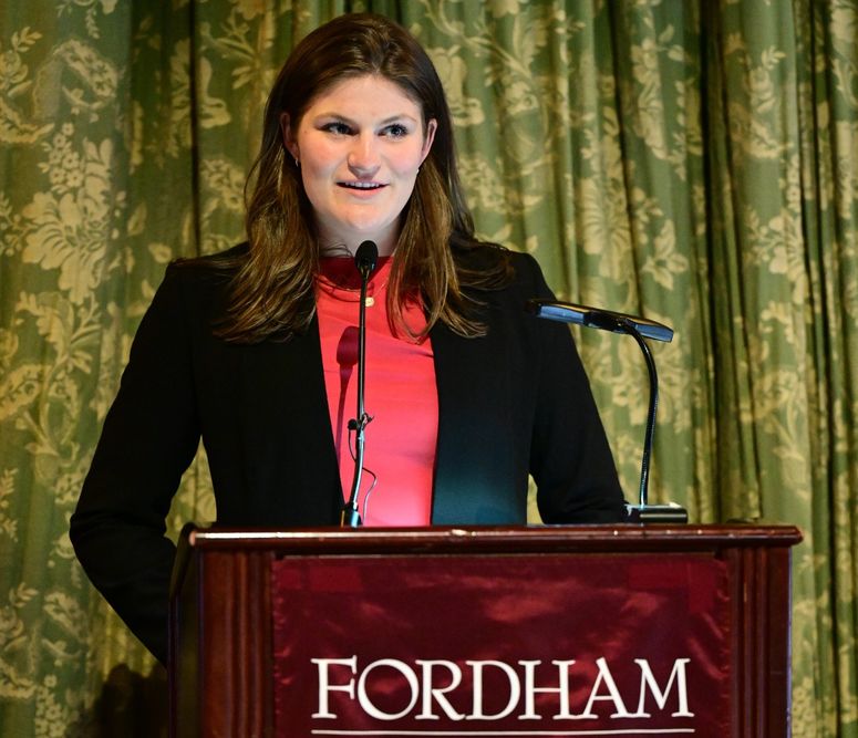 Female student standing at podium