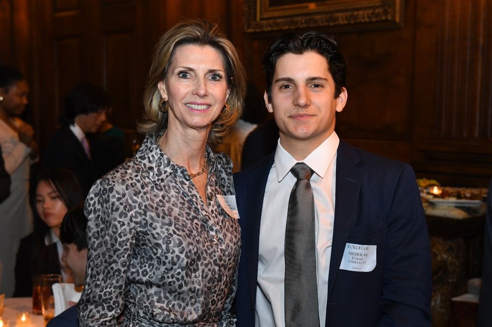 A female donor stands next to a male student at the 2024 Scholarship Donors and Recipients Reception