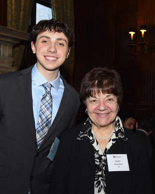 male student standing with female donor