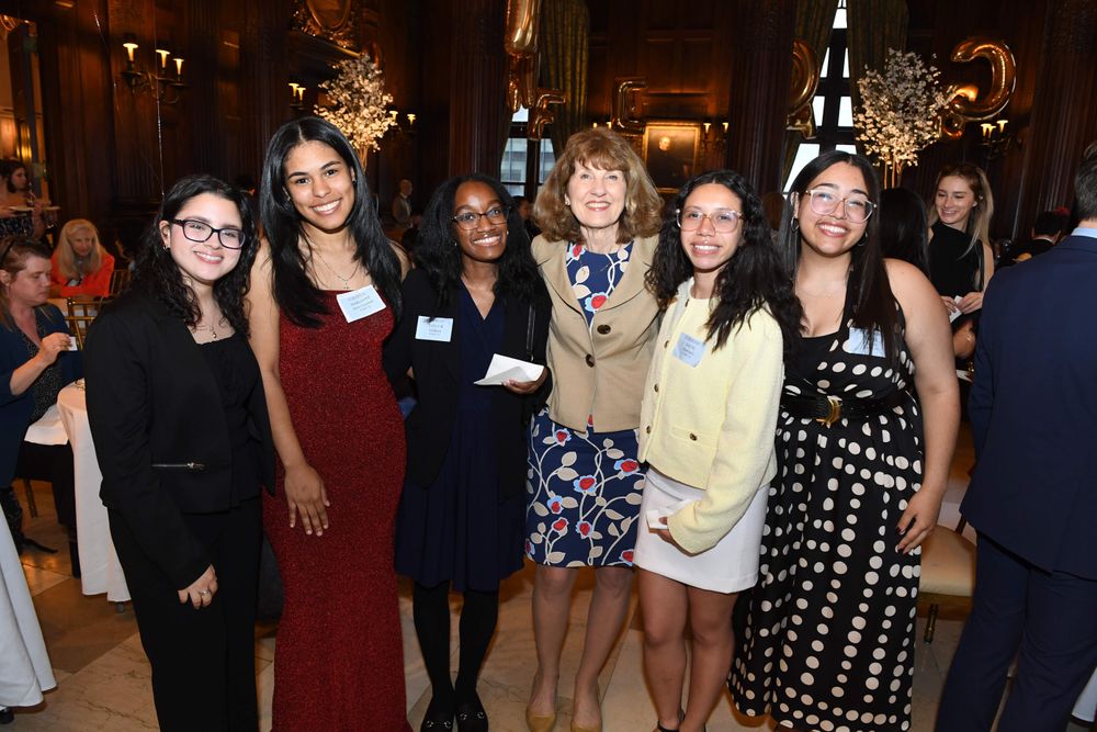 group of female scholars with female donor