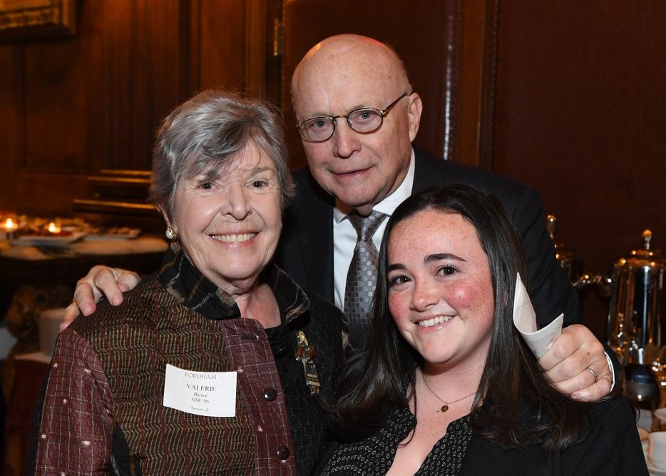A male and female donor stand with a female student at the Scholarship Donors and Recipients Reception