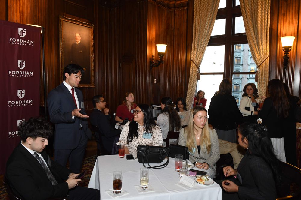 Male and female students conversing at the Scholarship Reception