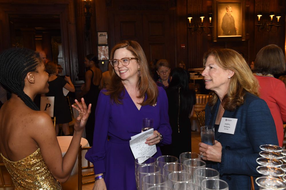 President Tetlow with Sheryl Dellapina speaking with scholar