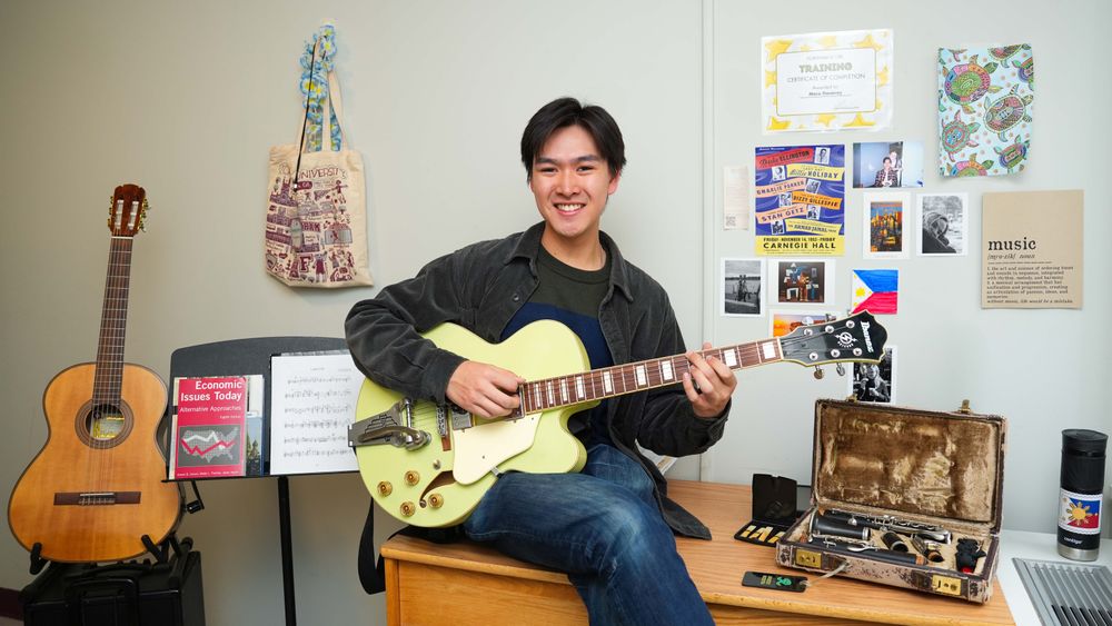 Student with guitar in McMahonHall