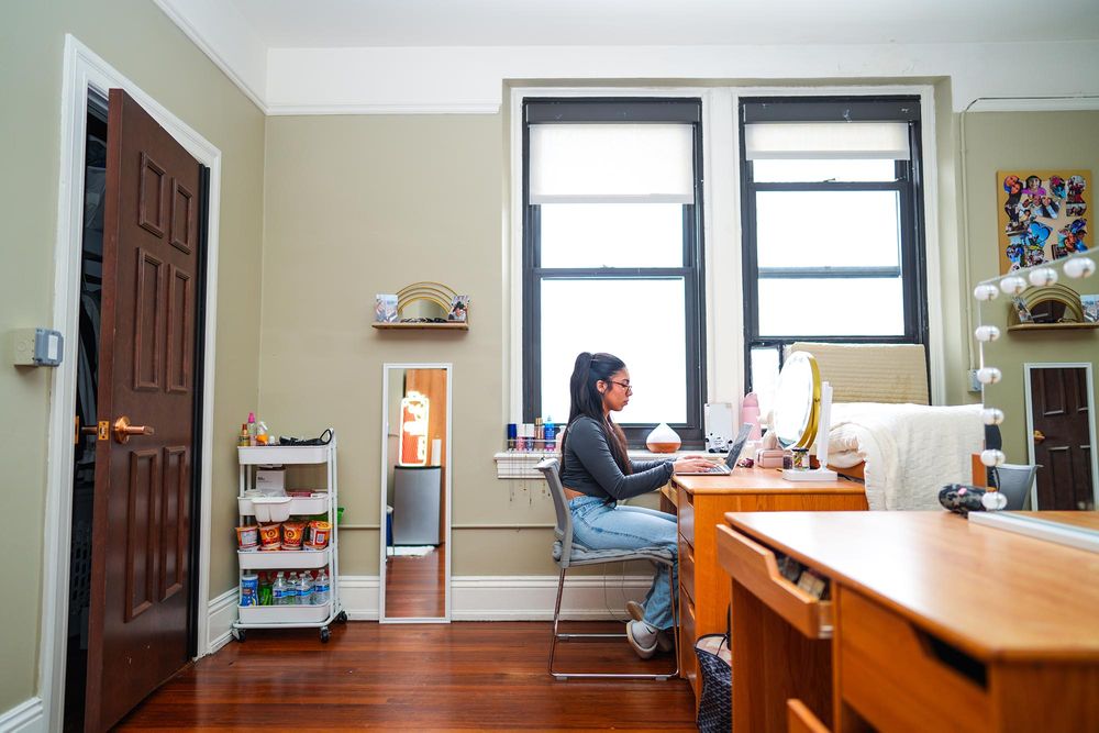Student studying in room in Loyola Hall