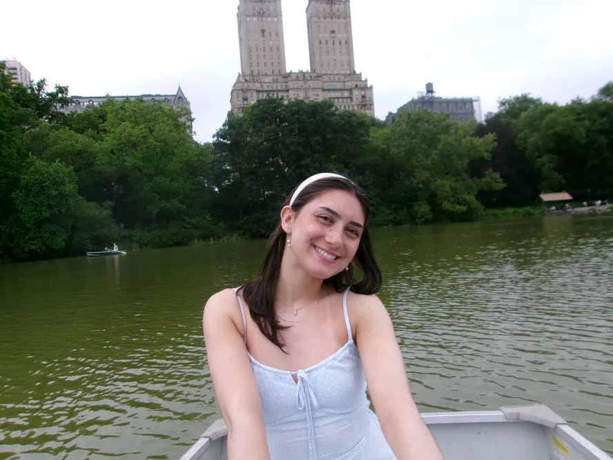 Emmie sitting in a boat in central park