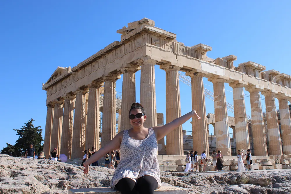 Manuela sitting in front of the acropolis