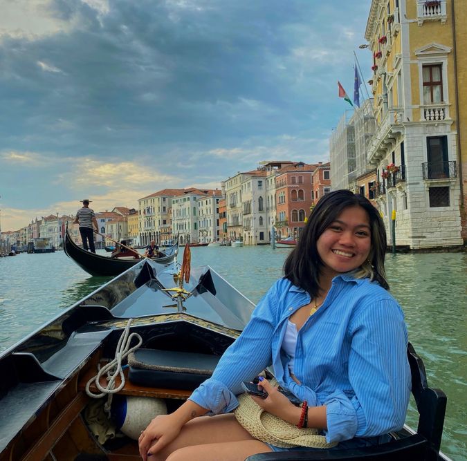 Paula sitting in a boat in Venice