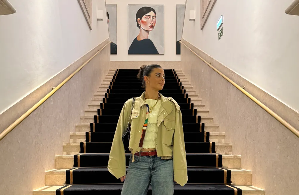 Student standing on stairs