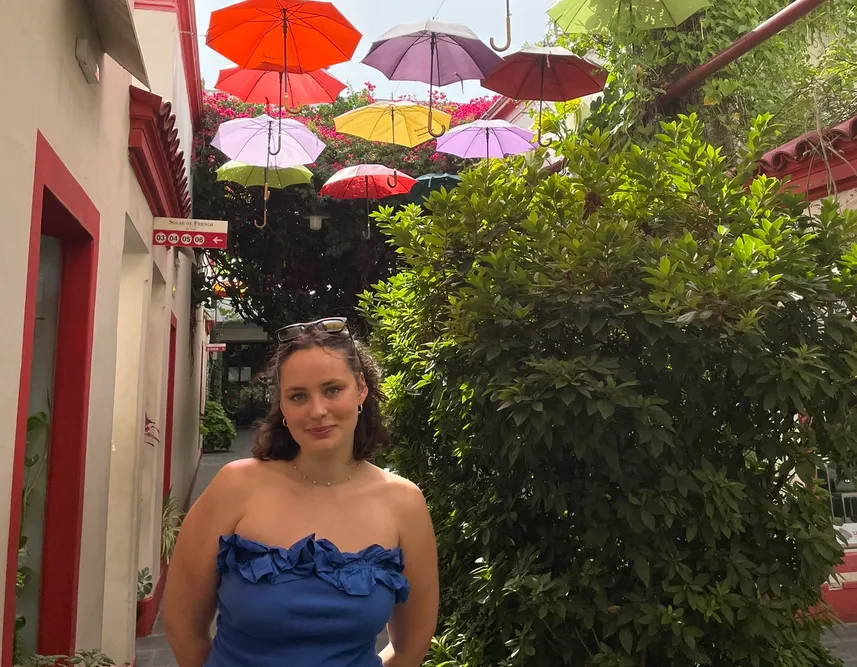 Student Standing in front of water