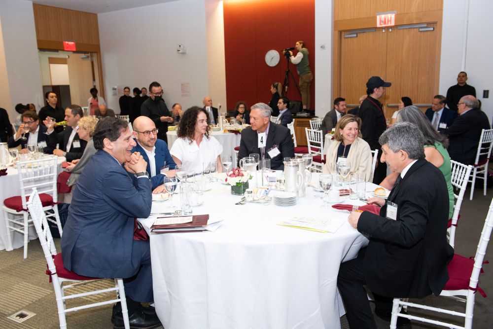 Dean Emeritus Diller Sitting at Table with Panel and Robert Posner