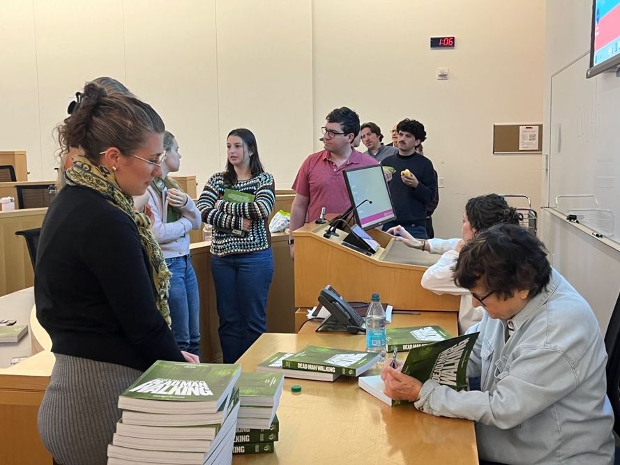 Sister Helen Prejean signs copy of book Dead Man Walking for students