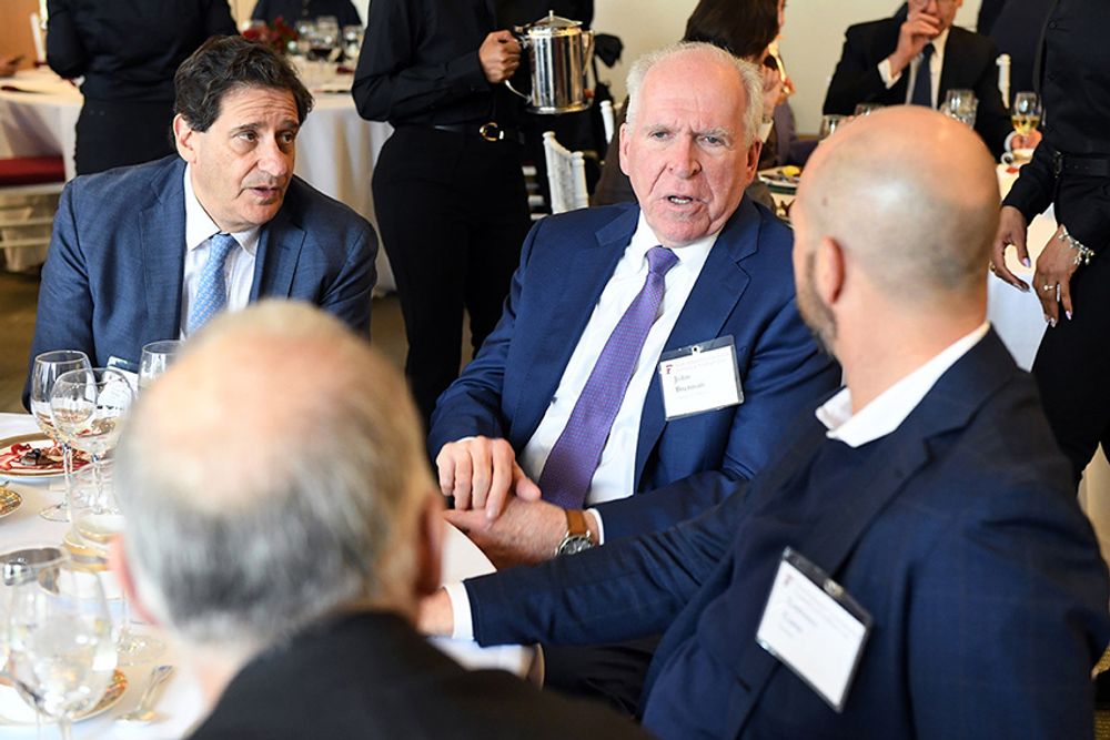 Dean Diller, Mr. Brennan, and Lorenzo Corte chat over lunch.