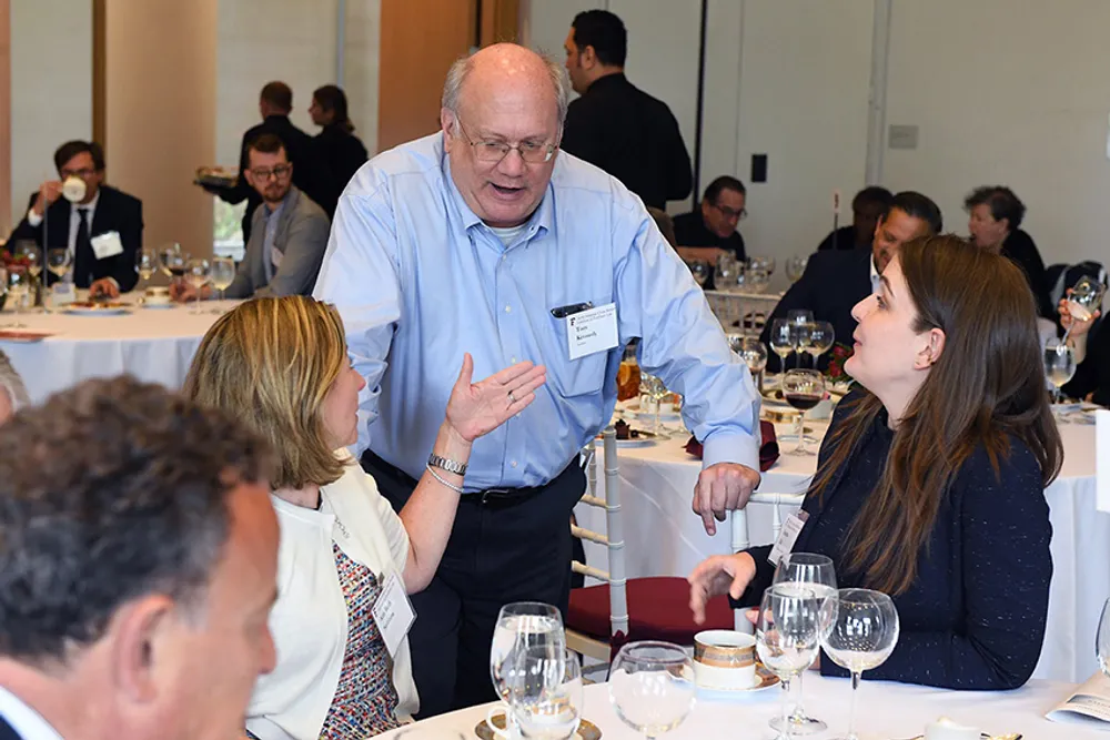 Skadden lawyers connect with guests and Fordham students.