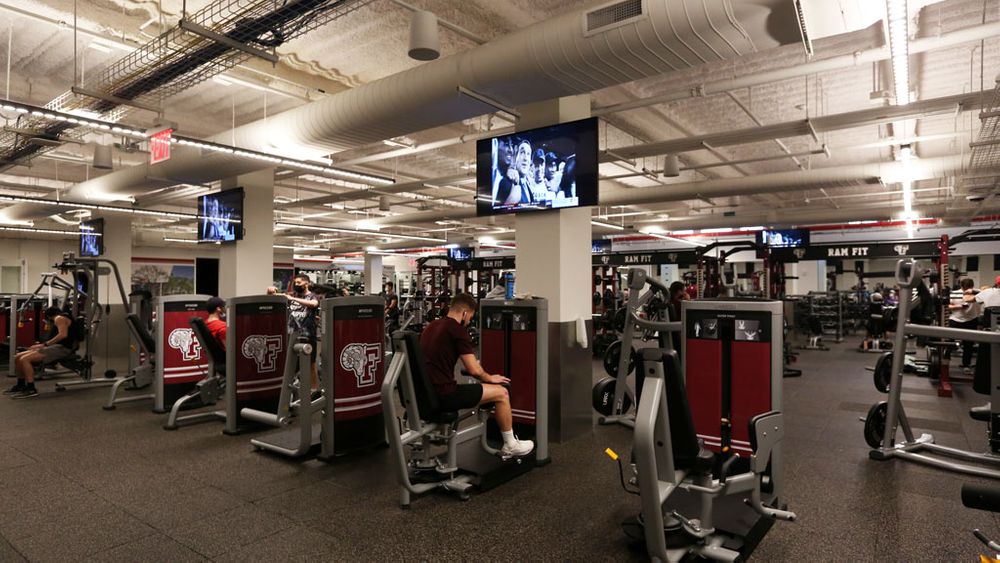 Student using equipment in the Rose Hill fitness center