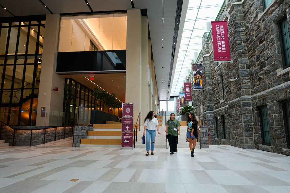 Students walk through the arcade in the McShane Center