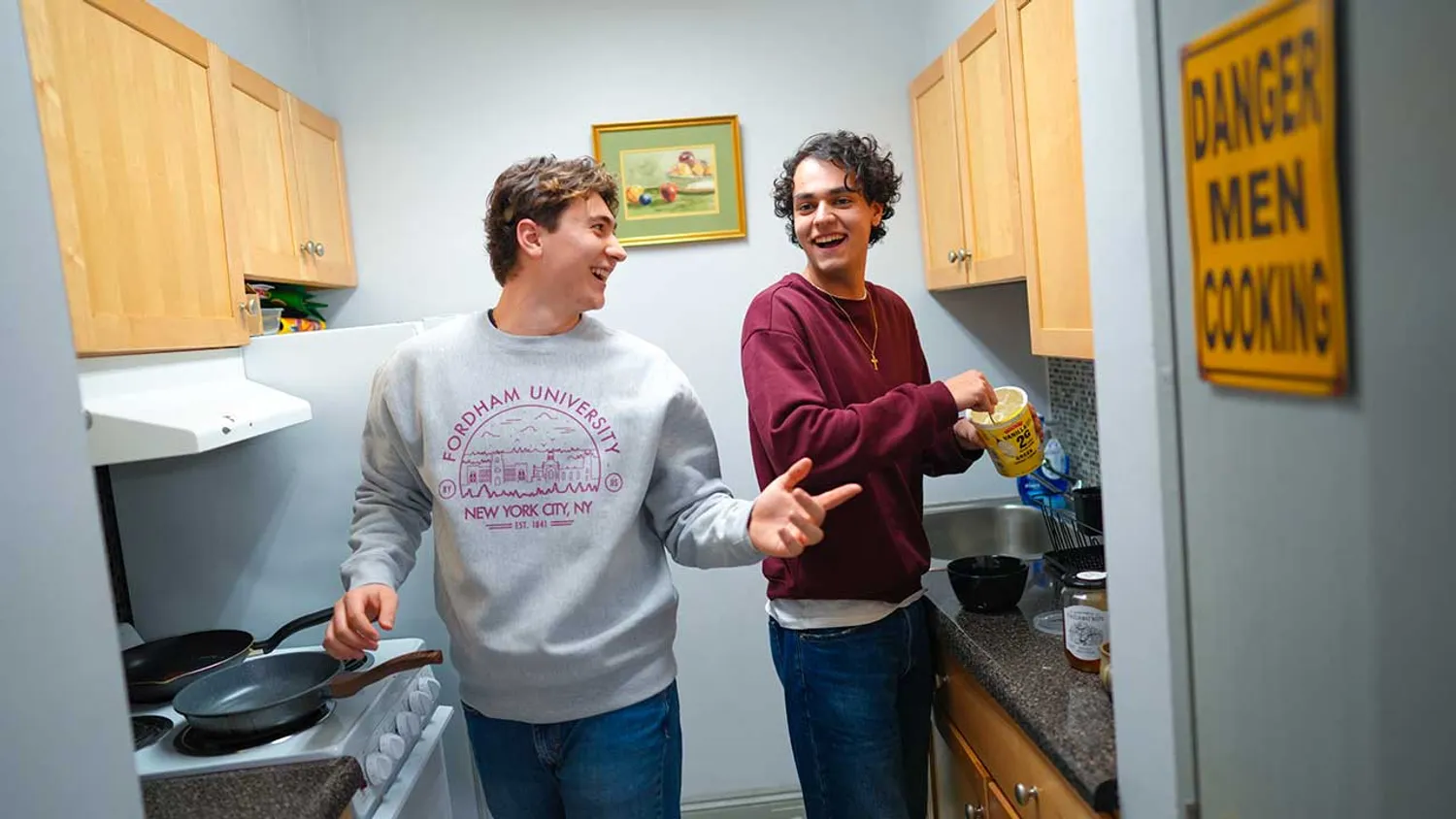 Two male students in dorm kitchen
