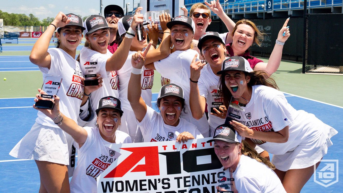 Avery alongside her tennis teammates after winning the A10 tournament