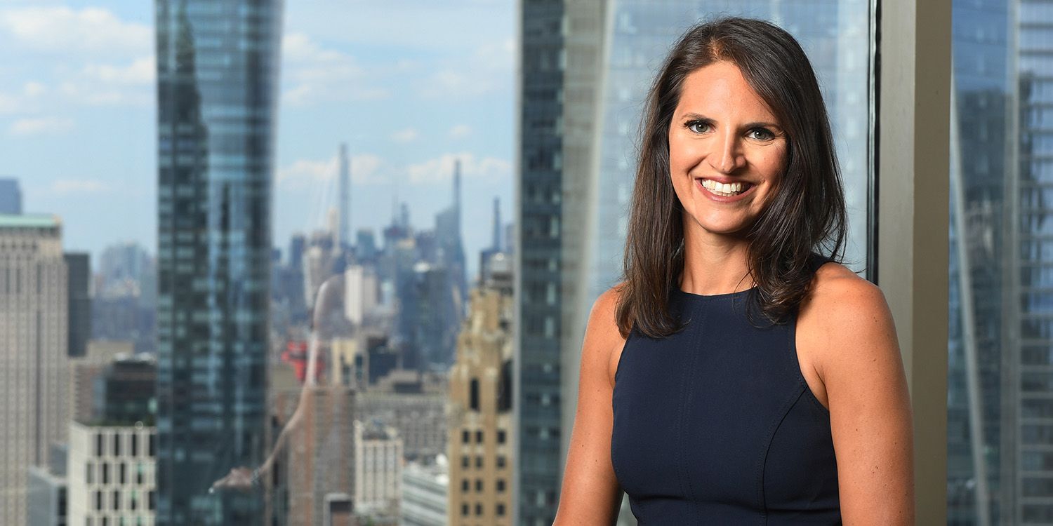Bonnie Neumann '06 in front of NYC skyline