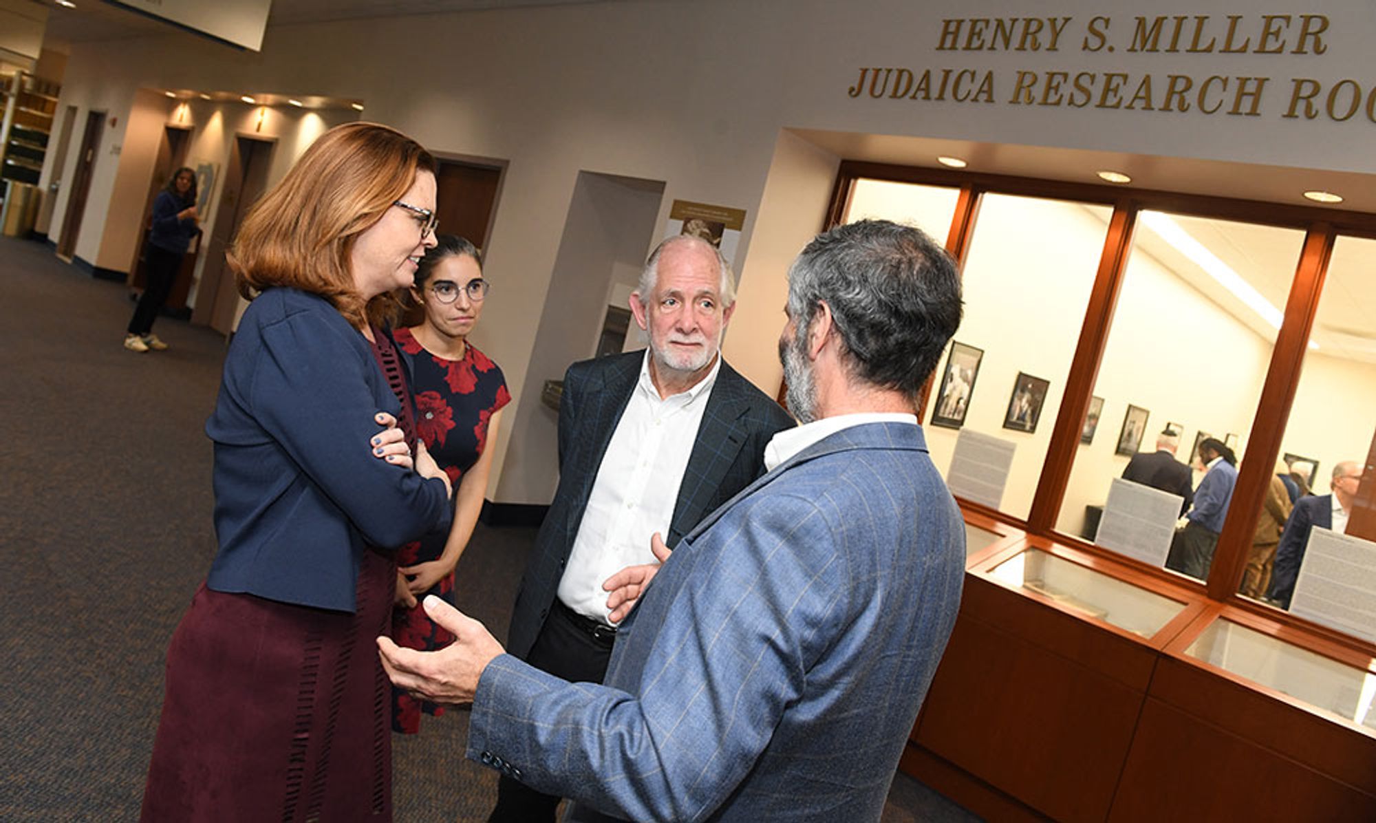 Miller outside the Judaica Research Room bearing his name with President Tania Tetlow and Professor Sarit Kattan Gribetz.