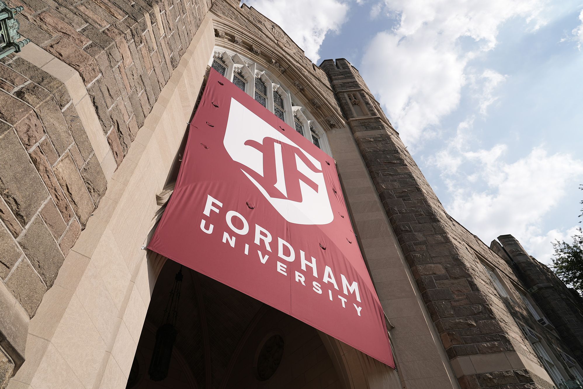 Fordham banner hanging from facade of Keating