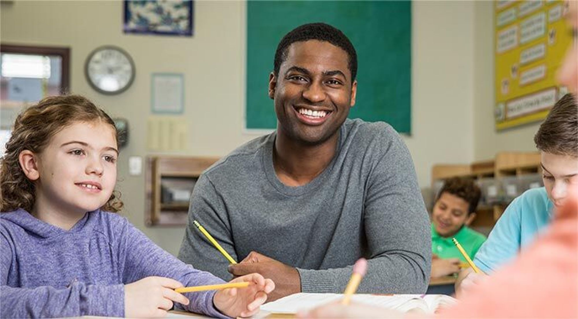 Male Teacher with students