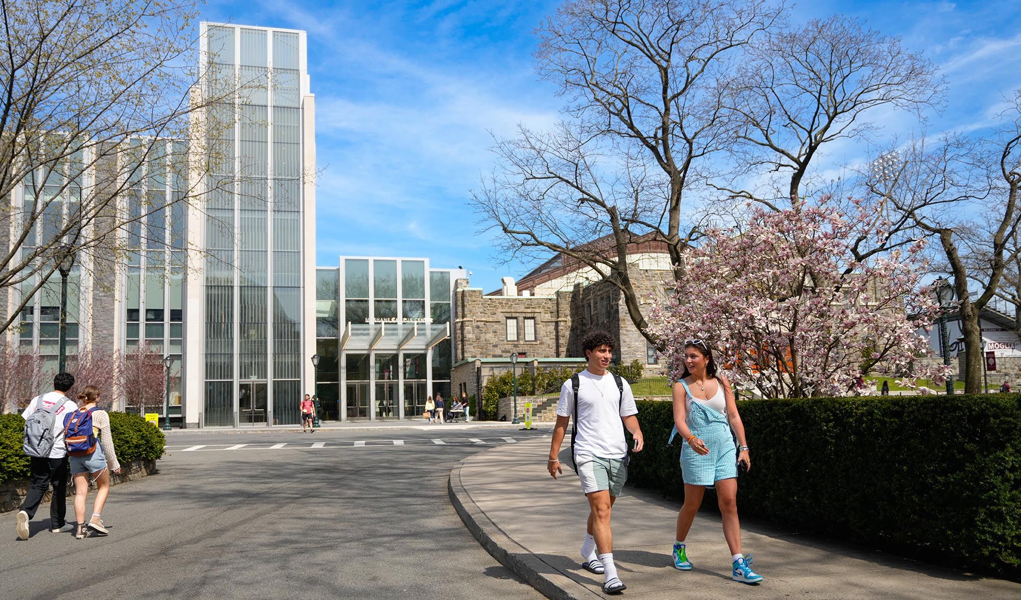 Two students walking on campus