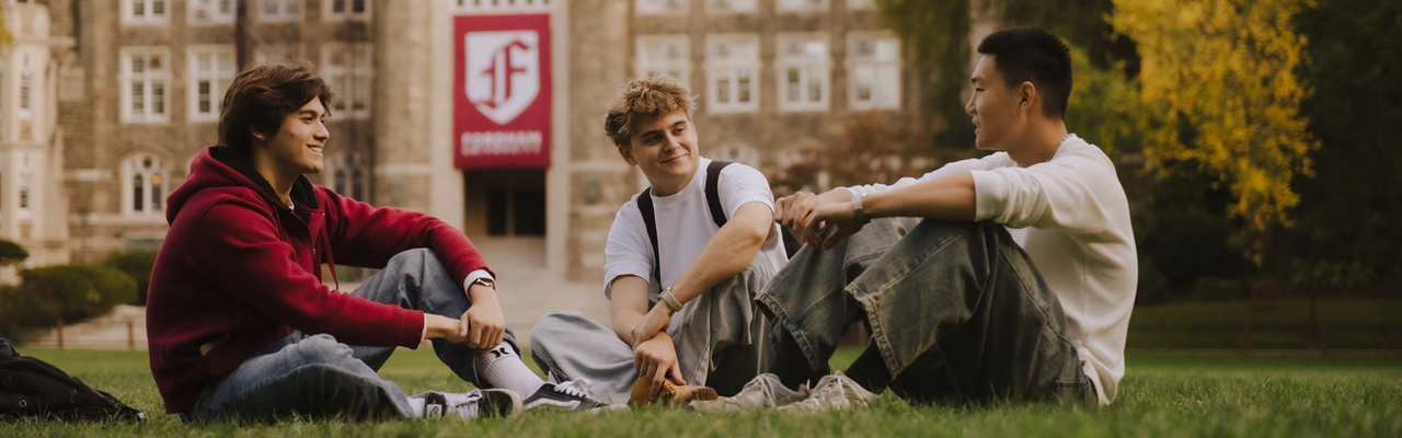 Students standing with shovels around a garden