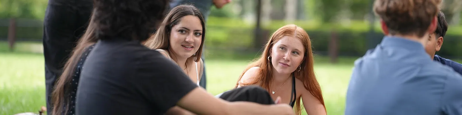 A group of students sitting outside